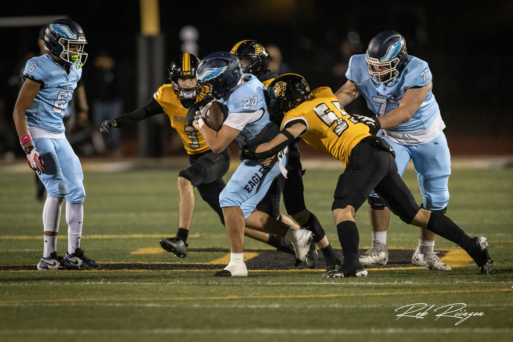 Defense making the tackle