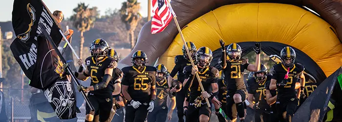 El Capitan Vaqueros Football hitting the field